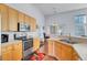 Bright kitchen boasts abundant cabinet space, offering plentiful storage and easy organization at 1473 Coopers Hawk Dr, Hanahan, SC 29410
