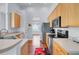 Well-maintained kitchen with stainless steel appliances and ample storage provides a clean and efficient cooking space at 1473 Coopers Hawk Dr, Hanahan, SC 29410