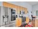 Modern kitchen featuring stainless steel refrigerator and stove, ideal for preparing meals and entertaining at 1473 Coopers Hawk Dr, Hanahan, SC 29410