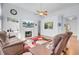 Inviting living room with a fireplace, built-in shelves, and hardwood floors creates a warm and stylish ambiance at 1473 Coopers Hawk Dr, Hanahan, SC 29410