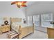 A serene main bedroom boasts high ceilings, bright windows and light neutral décor and furnishings at 1473 Coopers Hawk Dr, Hanahan, SC 29410