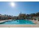 Inviting community pool surrounded by lush landscaping, perfect for a refreshing swim at 1473 Coopers Hawk Dr, Hanahan, SC 29410