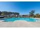 Sparkling community pool with ample deck space, ideal for relaxation and summer fun at 1473 Coopers Hawk Dr, Hanahan, SC 29410