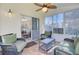 Inviting sunroom with wicker furniture and a ceiling fan at 1473 Coopers Hawk Dr, Hanahan, SC 29410