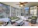 Relaxing sunroom featuring wicker furniture and ample natural light at 1473 Coopers Hawk Dr, Hanahan, SC 29410