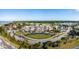 Expansive aerial view of a beautiful clubhouse, golf course, and meticulously landscaped grounds in a coastal community at 1614 Live Oak Park, Seabrook Island, SC 29455