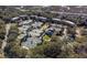 Aerial view of tennis courts and condos surrounded by lush landscaping and trees in an expansive community at 1614 Live Oak Park, Seabrook Island, SC 29455