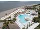 Sweeping aerial view of the beachfront pool, lounging, and clubhouse areas at 1614 Live Oak Park, Seabrook Island, SC 29455