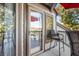 Outdoor balcony with seating and views, featuring a door leading to the interior of the home at 1614 Live Oak Park, Seabrook Island, SC 29455