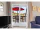 Scenic balcony view with outdoor seating, showcasing lush greenery and partial views of the sky at 1614 Live Oak Park, Seabrook Island, SC 29455