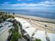 Aerial view of the beach featuring shade structures, lounge chairs, and ocean views at 1614 Live Oak Park, Seabrook Island, SC 29455