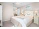 Bright bedroom featuring a bed with decorative pillows, a vanity, and a ceiling fan at 1614 Live Oak Park, Seabrook Island, SC 29455