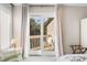 Relaxing bedroom with balcony access and scenic views of trees and water at 1614 Live Oak Park, Seabrook Island, SC 29455