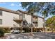 Elevated condo featuring covered parking, a neutral exterior, and private balconies offering outdoor living at 1614 Live Oak Park, Seabrook Island, SC 29455