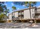 Three-story condo featuring covered parking, balconies, and lush palm trees for a tropical feel at 1614 Live Oak Park, Seabrook Island, SC 29455