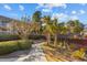 Exterior view highlighting mature trees, landscaped grounds, and a walkway in the neighborhood at 1614 Live Oak Park, Seabrook Island, SC 29455