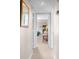 Bright hallway with carpet and a mirror leading to a bedroom at 1614 Live Oak Park, Seabrook Island, SC 29455