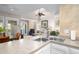Open concept kitchen with sink and island, flowing into the dining and living areas at 1614 Live Oak Park, Seabrook Island, SC 29455