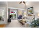 Bright living room with a high ceiling, neutral colors, and a patio offering scenic views at 1614 Live Oak Park, Seabrook Island, SC 29455