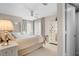 Serene main bedroom with a ceiling fan, neutral colors, and ensuite bathroom access at 1614 Live Oak Park, Seabrook Island, SC 29455