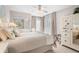 Inviting main bedroom with a ceiling fan, mirrored closet, and a cozy chair at 1614 Live Oak Park, Seabrook Island, SC 29455
