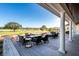 Inviting patio with comfortable seating, overlooking a lush green golf course on a sunny day at 1614 Live Oak Park, Seabrook Island, SC 29455