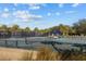 Well-maintained tennis courts with lush landscaping and a covered seating area in the background at 1614 Live Oak Park, Seabrook Island, SC 29455