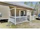 Cozy covered back porch with white railing, perfect for relaxing outdoors at 162 Wal Flo Ln, Moncks Corner, SC 29461