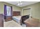 Bedroom features a wooden bed frame, a ceiling fan, and natural light, creating a cozy atmosphere at 162 Wal Flo Ln, Moncks Corner, SC 29461