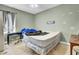Bedroom featuring a bed, a window with curtains, and minimalist decor, offering a comfortable living space at 162 Wal Flo Ln, Moncks Corner, SC 29461