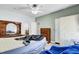 Bedroom featuring a bed and a dresser, and a view into an adjacent bedroom, creating a functional living area at 162 Wal Flo Ln, Moncks Corner, SC 29461