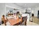 Open dining and living area, perfect for entertaining, showcasing wood flooring at 162 Wal Flo Ln, Moncks Corner, SC 29461