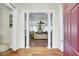 Open entryway into the living room, featuring elegant columns and hardwood floors at 162 Wal Flo Ln, Moncks Corner, SC 29461