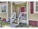 Close-up of the front entry steps with a red door at 162 Wal Flo Ln, Moncks Corner, SC 29461