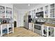 Charming kitchen with stainless steel appliances, tile backsplash, and ample white cabinet storage space at 162 Wal Flo Ln, Moncks Corner, SC 29461