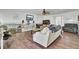 Comfortable living room with wood floors, neutral furniture, and abundant natural light at 162 Wal Flo Ln, Moncks Corner, SC 29461