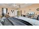 Generous main bedroom features a tray ceiling, a ceiling fan, and hardwood floors at 162 Wal Flo Ln, Moncks Corner, SC 29461