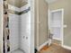 Tiled shower with a glass door, accented with decorative mosaic tiles, providing a modern spa-like experience at 162 Wal Flo Ln, Moncks Corner, SC 29461