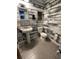 Modern bathroom with pedestal sink, wood-look accent wall, and tiled flooring at 1770 Skinner Ave, Charleston, SC 29407