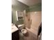 Bathroom showcasing a vanity, toilet, and a shower-tub combination with shower curtain and overhead storage at 1770 Skinner Ave, Charleston, SC 29407