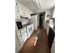 Bright kitchen featuring white cabinetry, updated appliances, and wood-look flooring at 1770 Skinner Ave, Charleston, SC 29407