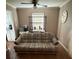 Cozy living room area featuring a ceiling fan and a comfortable patterned sofa at 1770 Skinner Ave, Charleston, SC 29407