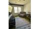 Cozy living room featuring a comfortable recliner, natural light, and a wall-mounted television at 1770 Skinner Ave, Charleston, SC 29407