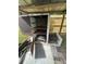 Outdoor grill with metal grates, open door, firewood, and a protective roof structure at 1770 Skinner Ave, Charleston, SC 29407