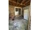 Outdoor patio with steps leading to sliding glass door, wooden support structure, and brick wall at 1770 Skinner Ave, Charleston, SC 29407