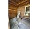 Open-air patio space with shelving, brick wall, and steps up to a sliding glass door at 1770 Skinner Ave, Charleston, SC 29407