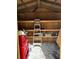 Organized shed interior with shelving, a ladder, tools, and storage for various supplies at 1770 Skinner Ave, Charleston, SC 29407