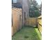 Fenced side yard with a wooden gate and grass at 1770 Skinner Ave, Charleston, SC 29407