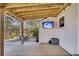 Covered deck with TV, perfect for outdoor entertaining and relaxation at 1950 Culver Ave, Charleston, SC 29407