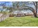 Large backyard with ample space for entertaining, featuring a well-kept lawn and wooden deck at 1950 Culver Ave, Charleston, SC 29407